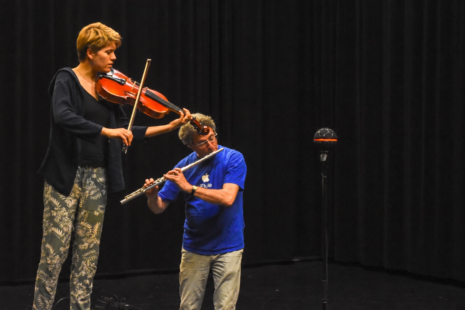 Two musicians performing on flute and viola during the spatial audio experiments.