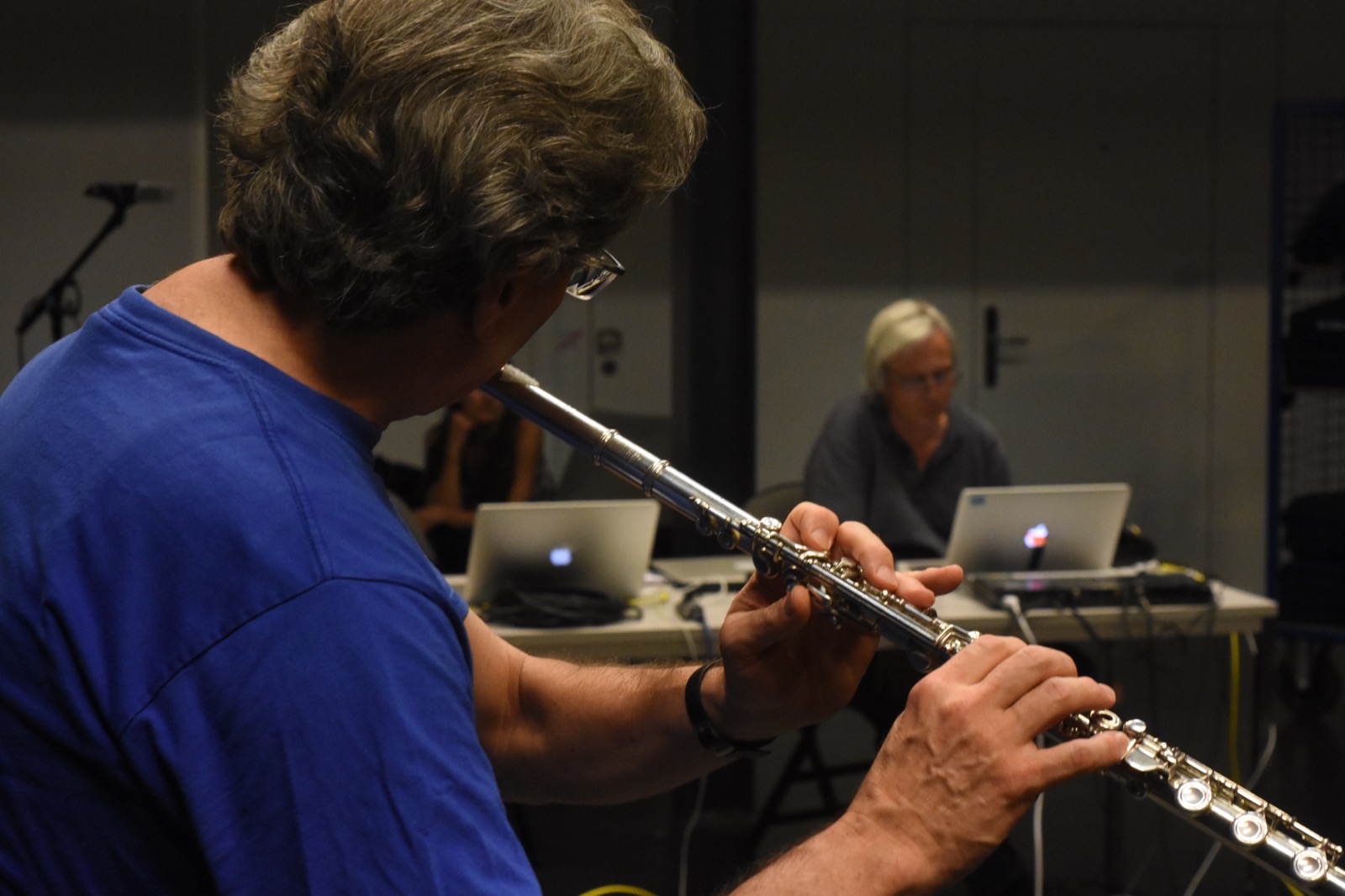 A musician playing flute during the June 2019 spatial audio experiments.